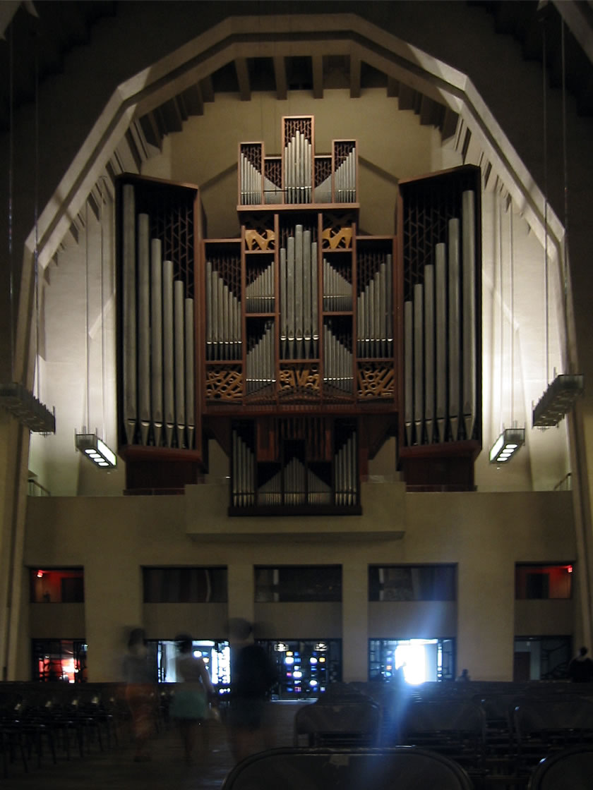 a large wooden organ hanging from the ceiling