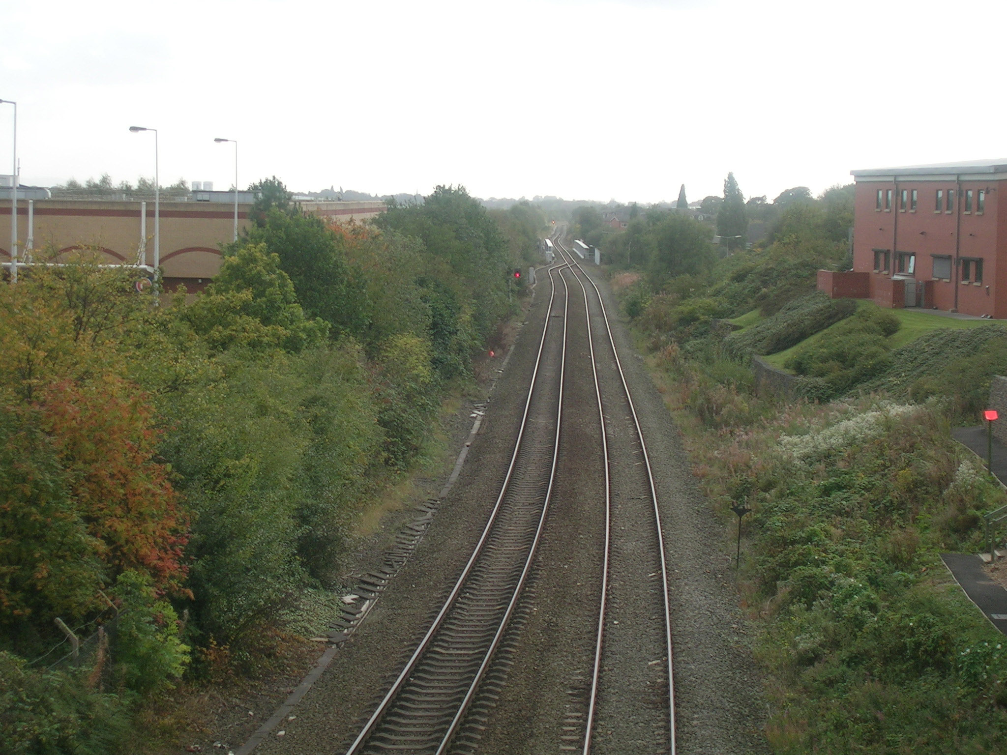 a train is going down the railroad tracks