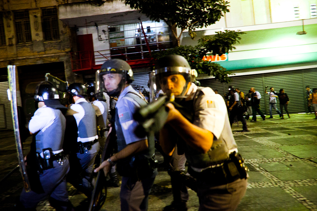 police officers standing in line holding guns