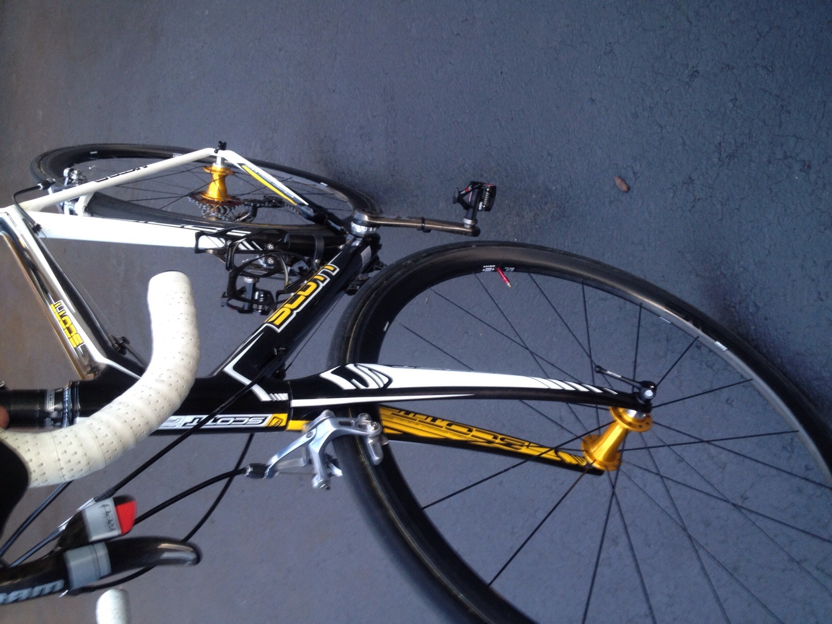 a close up view of a bicycle with yellow bars