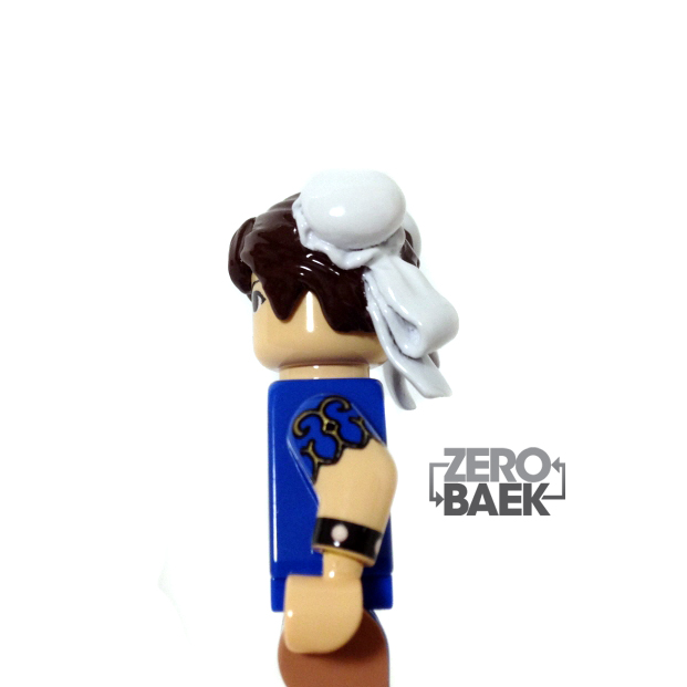 there is a man in blue lego style figure with the word hero baek on it