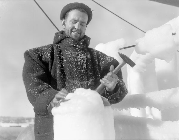 man with a hammer and an ice - carving sword on deck