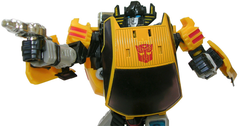 a yellow and black transformer with an antenna and head on it