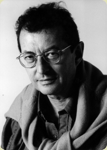 a black and white po of a man with glasses