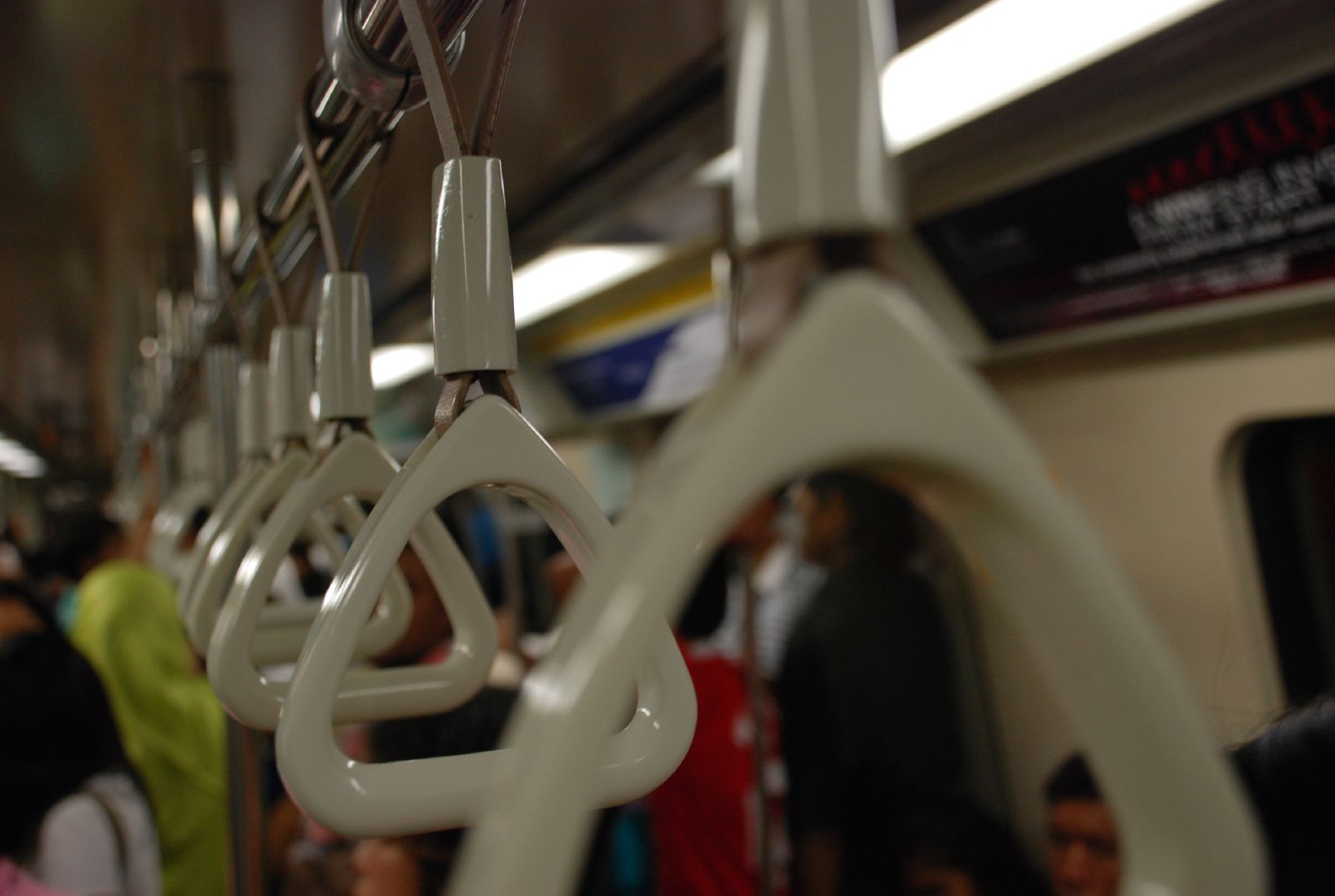 a bunch of people standing in line on a train