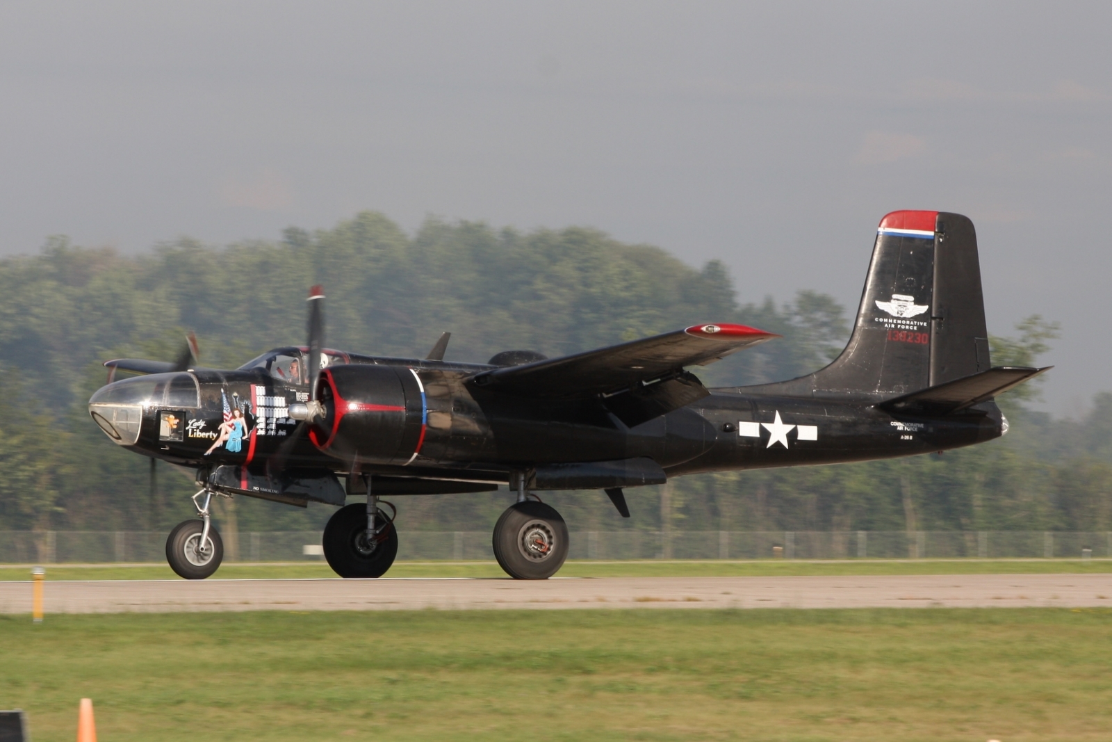 an airplane on the runway just starting taking off