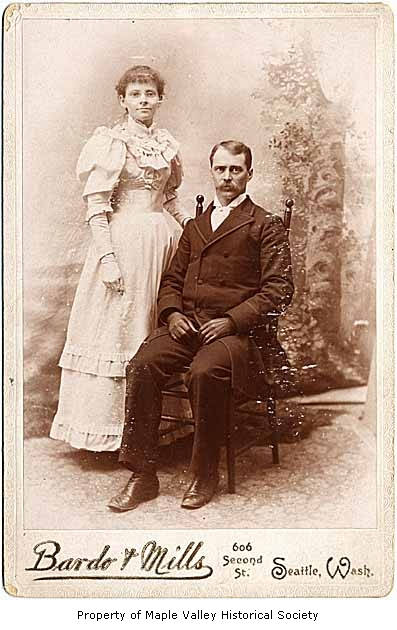 an old picture of an older couple on a bench