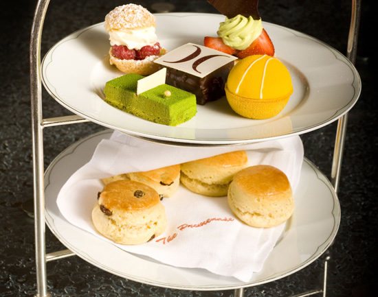 two tiered trays with various baked goods on them