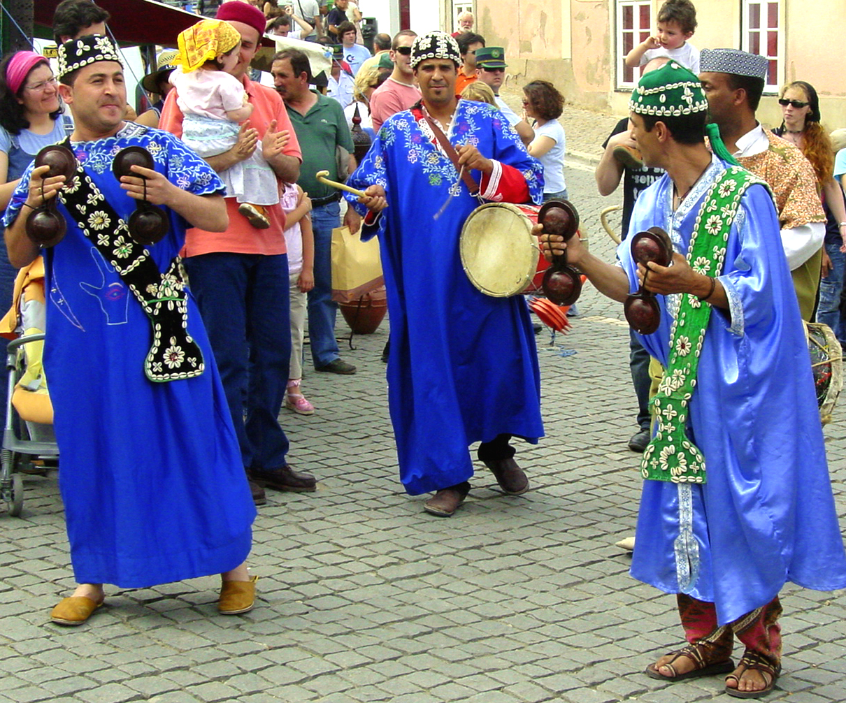 several people are wearing blue clothes and colorful hats