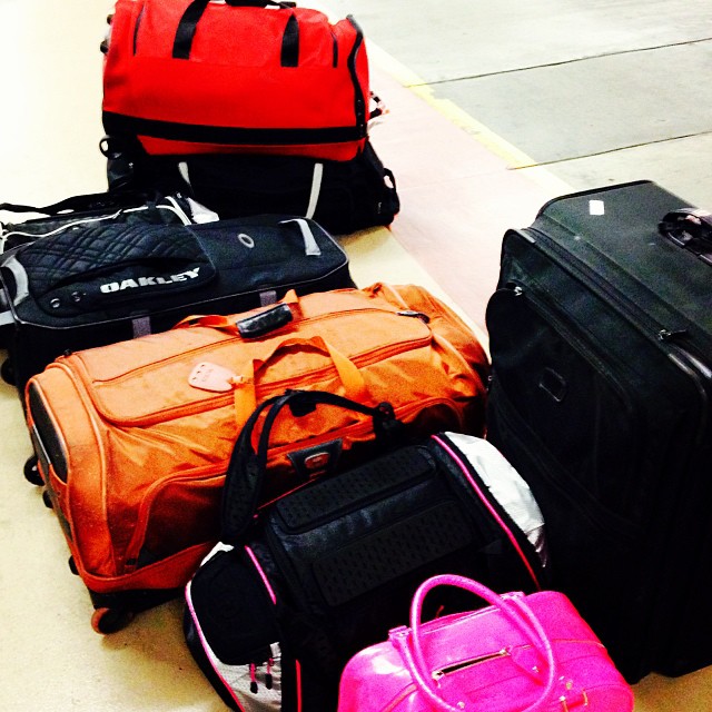 many types of luggage on the ground with one on a roll bag