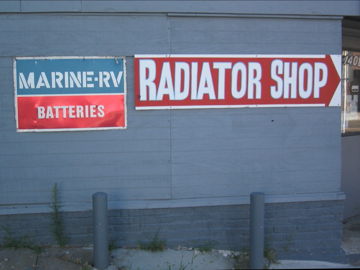 a shop with a marine - rv radiator shop sign