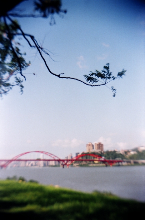 a large long bridge going across a river