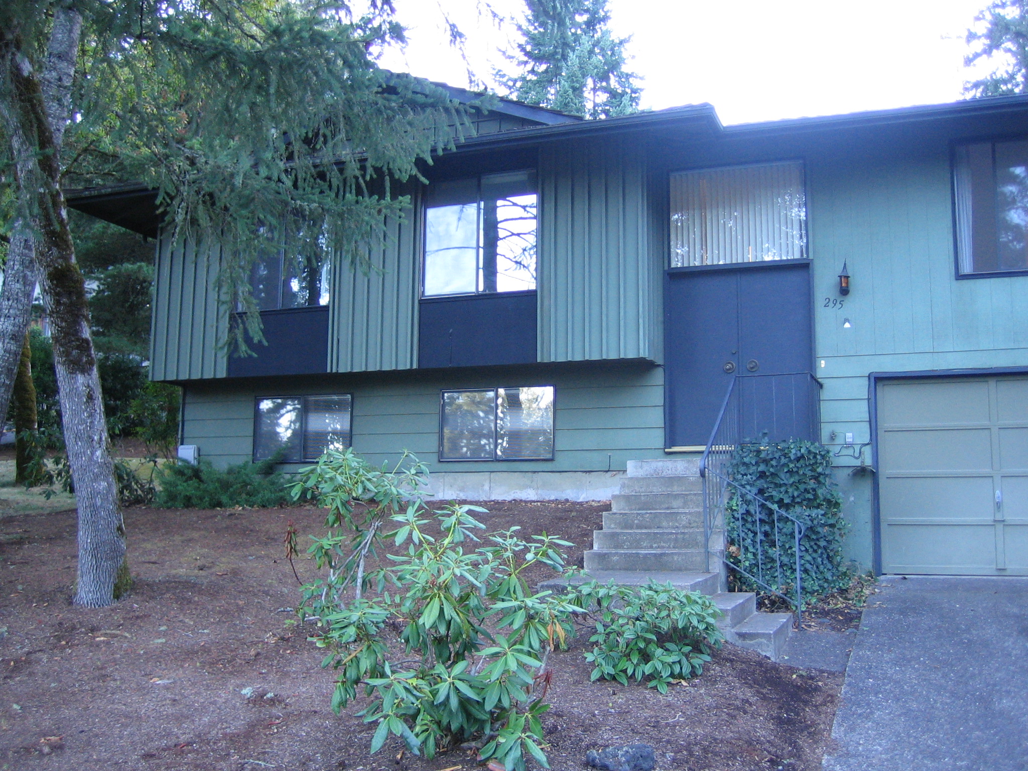 a home with a large door and several windows