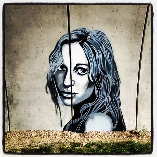 graffiti drawing of a woman with long hair