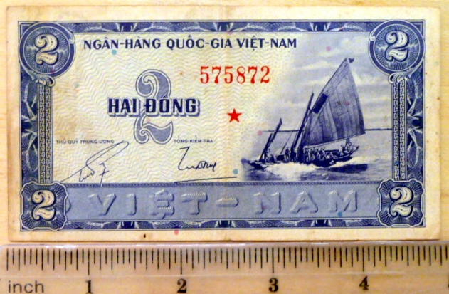 an asian bank note is in the ruler
