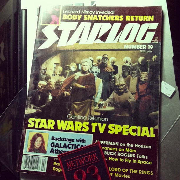 an old starlog magazine with the cover surrounded by other stories