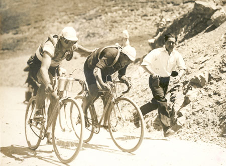 three people riding bicycles in an old fashioned po