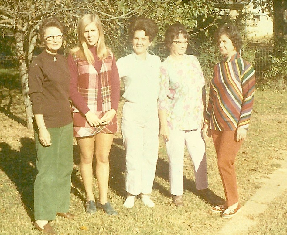 a group of young women pose for the camera