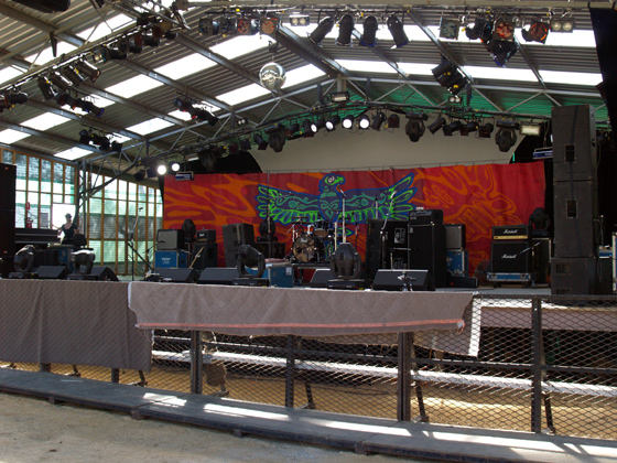 a stage is set up with white curtains