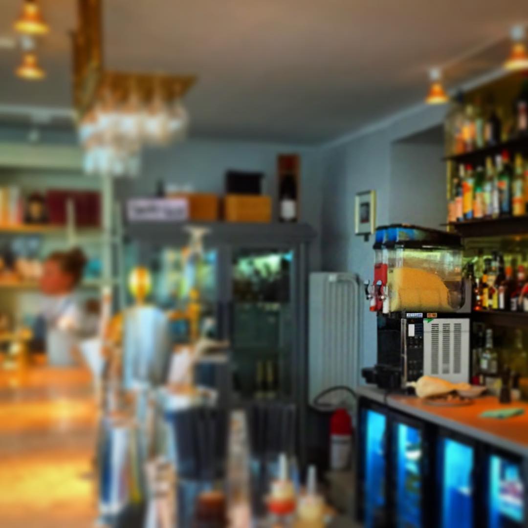 blurred pograph of a room with bar and menu