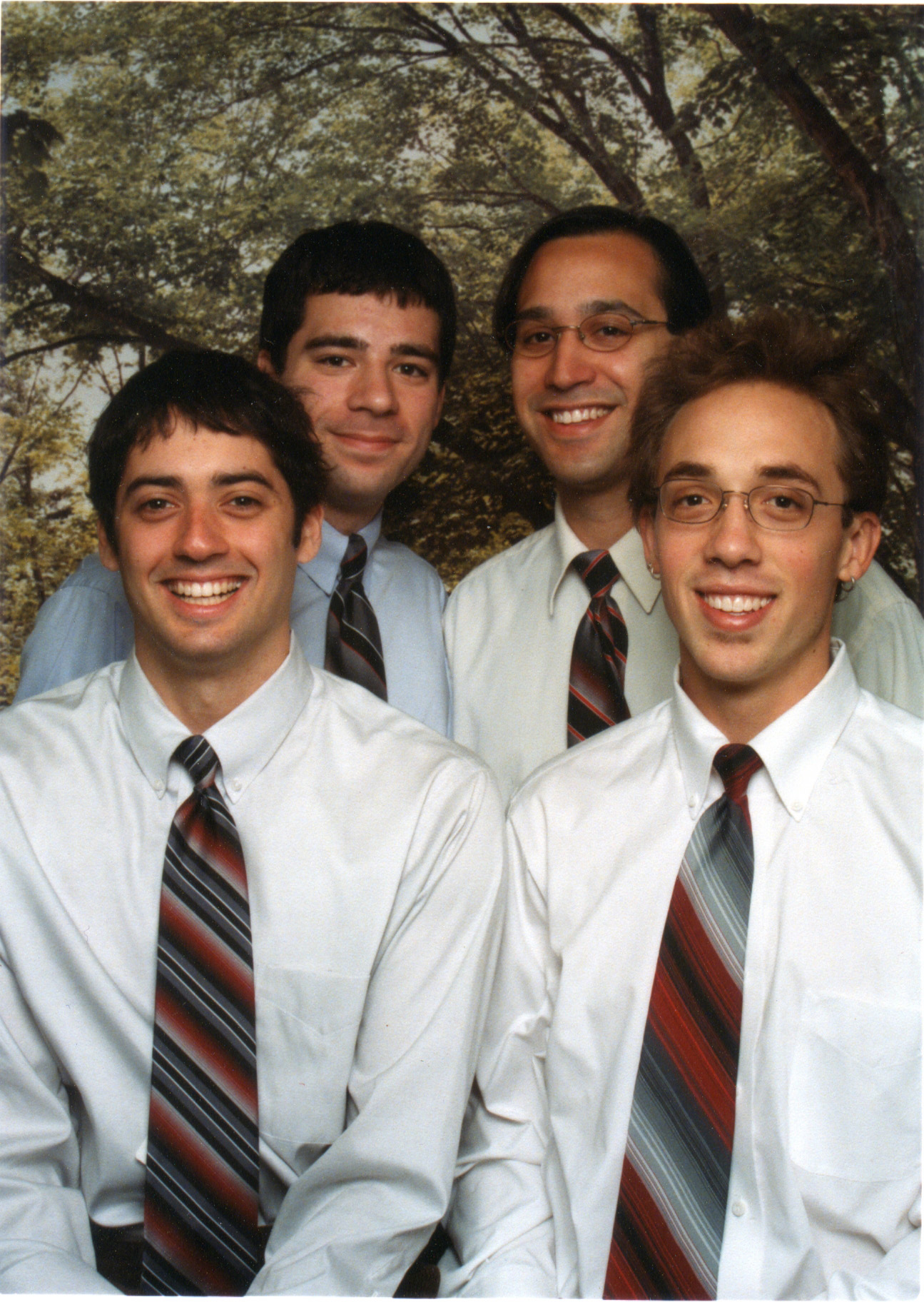 four young men are posing for a po