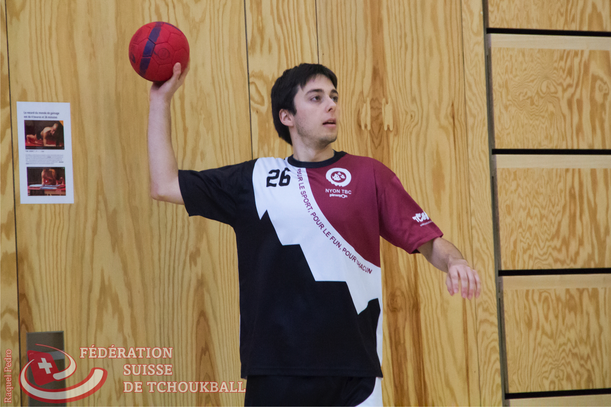 a man throwing a basketball up into the air