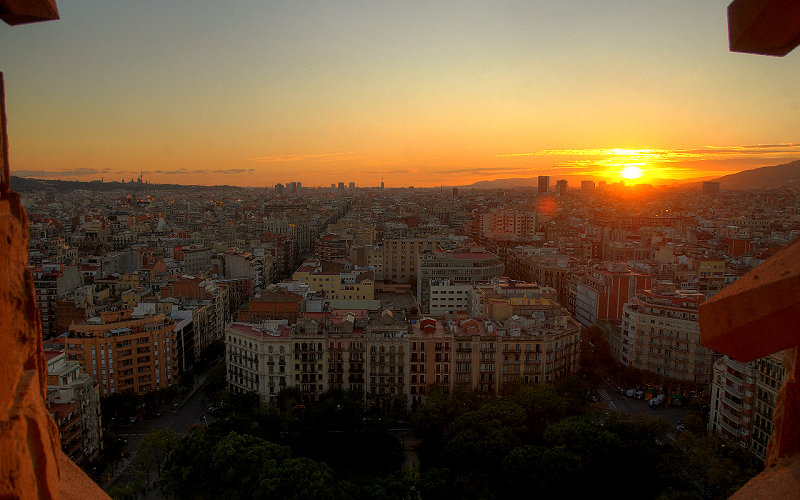 a sunset view of the city from a window