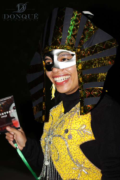 a person dressed in costume holding a magazine