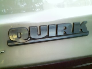 the letters on a car's front badge say'quirk '