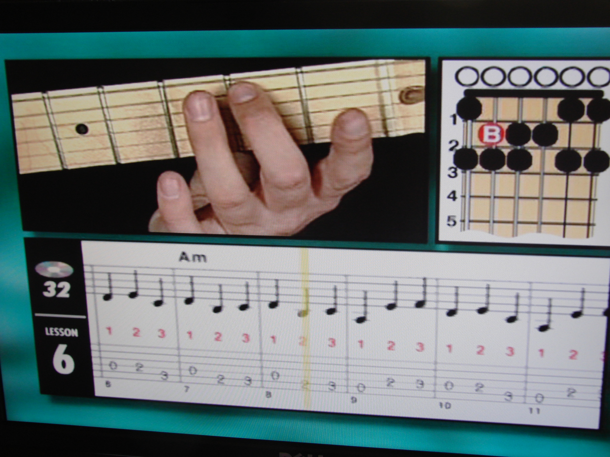 a po with hands playing music and guitar symbols on the television screen