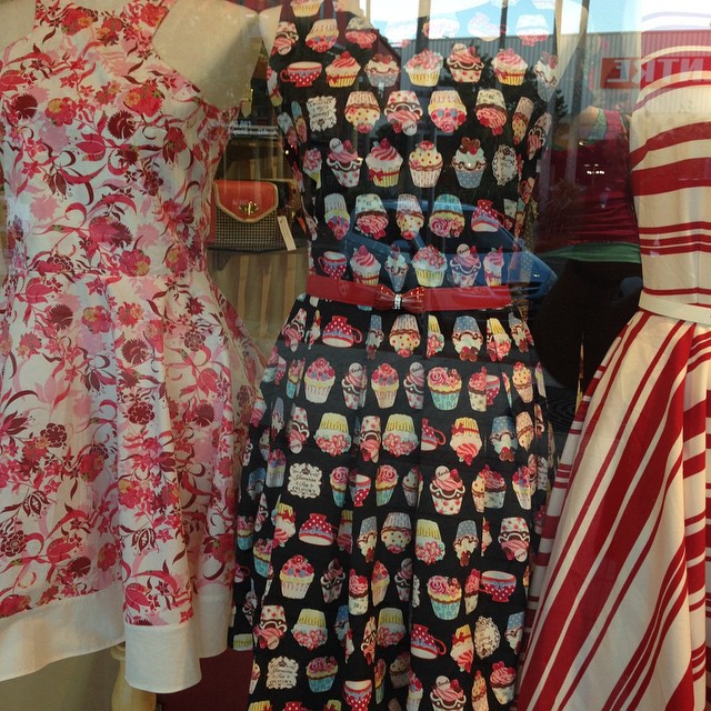 the mannequin is displaying a collection of dresses