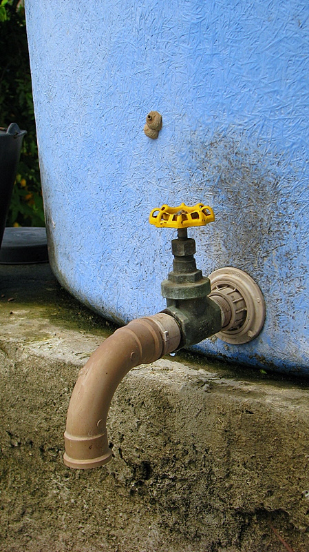 a water hose connected to a blue building