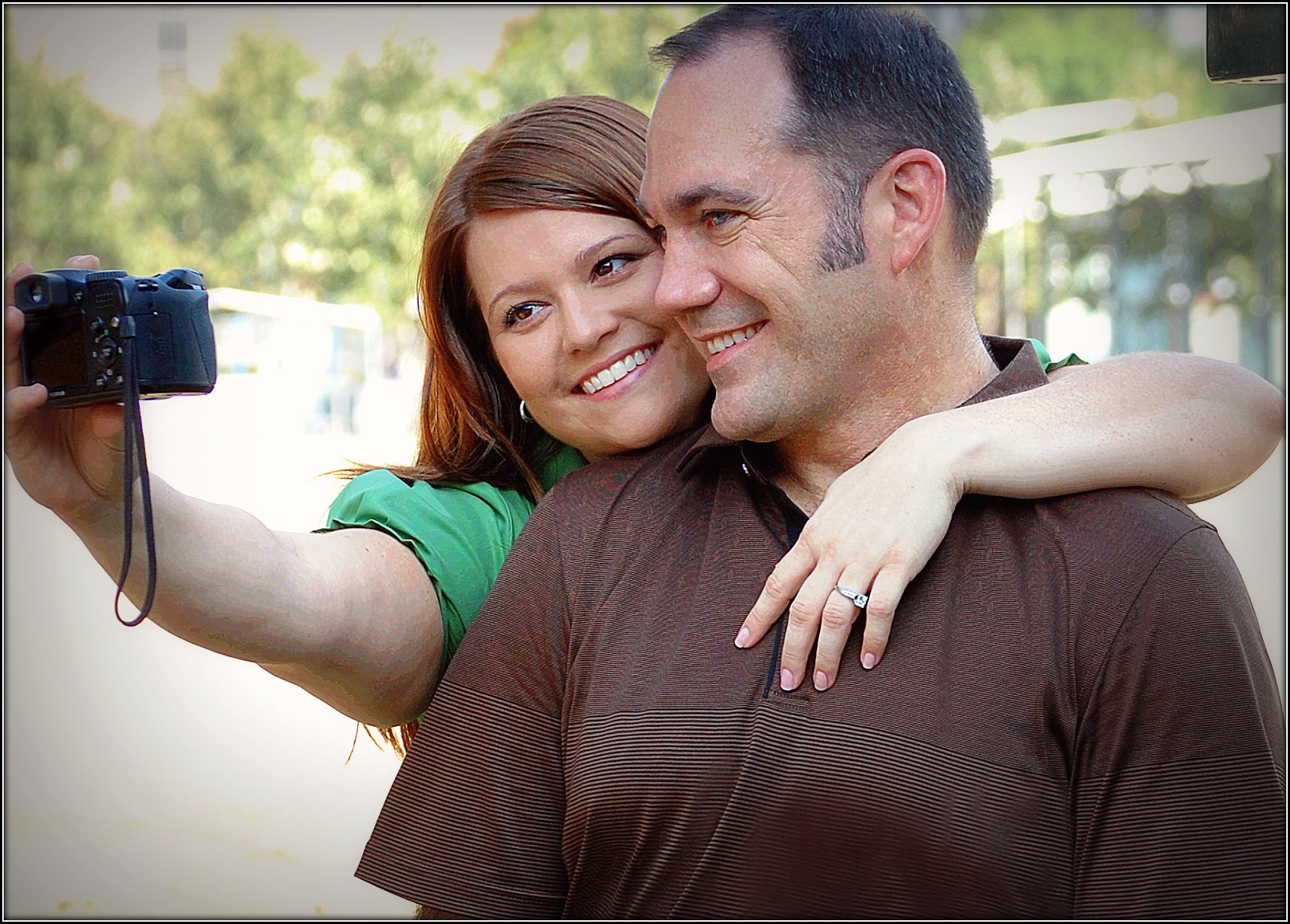 a couple taking a selfie and selfie with their camera