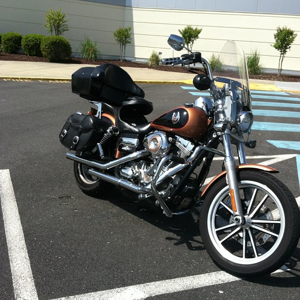 a motorcycle parked in the middle of a parking lot