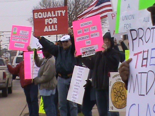protestors are holding signs with the word equal rights, equal rights, and equal wage rights