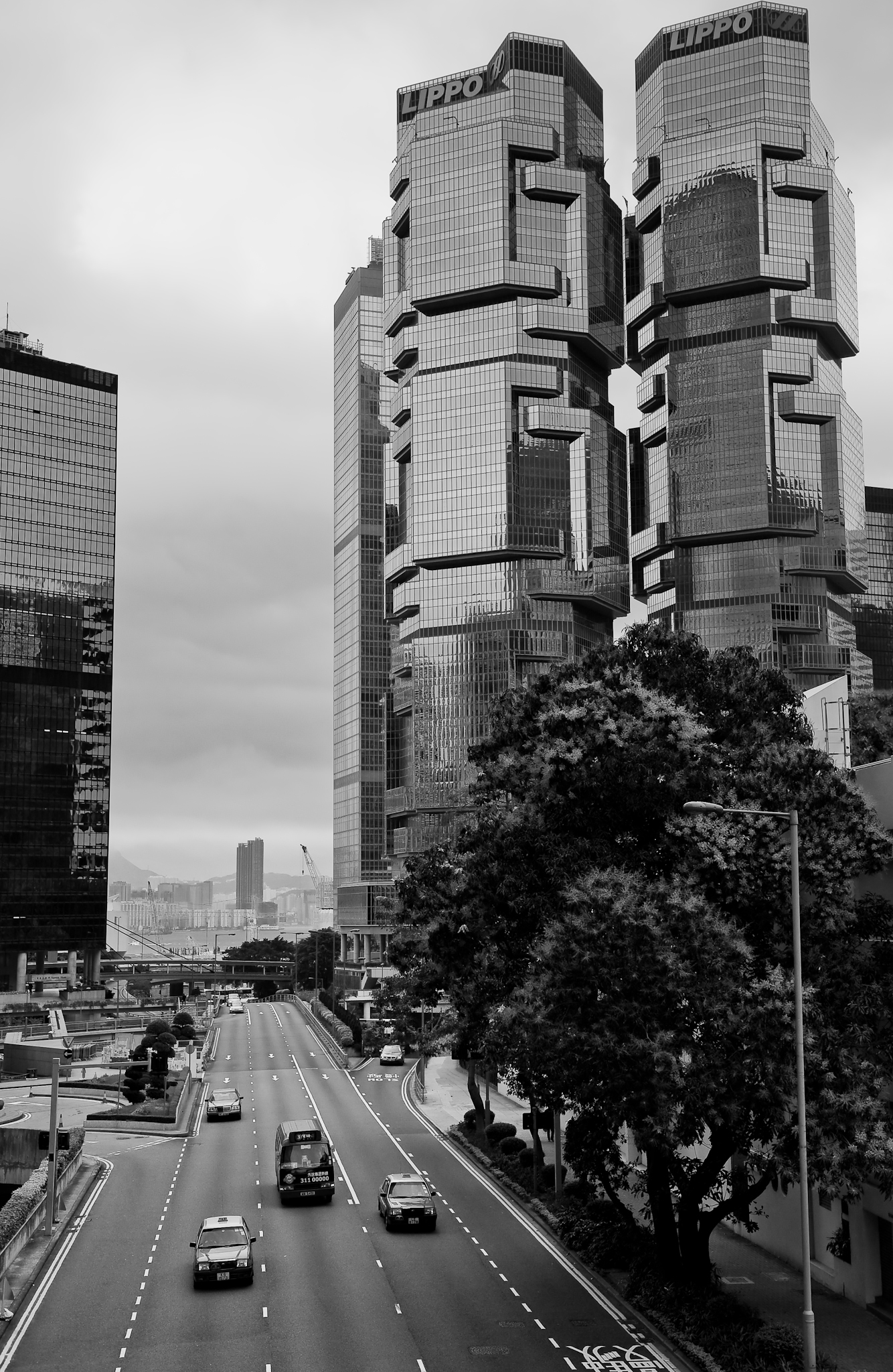 a view down an intersection, looking towards some tall buildings