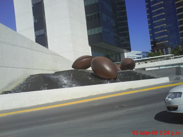 the large abstract sculptures are near the modern architecture