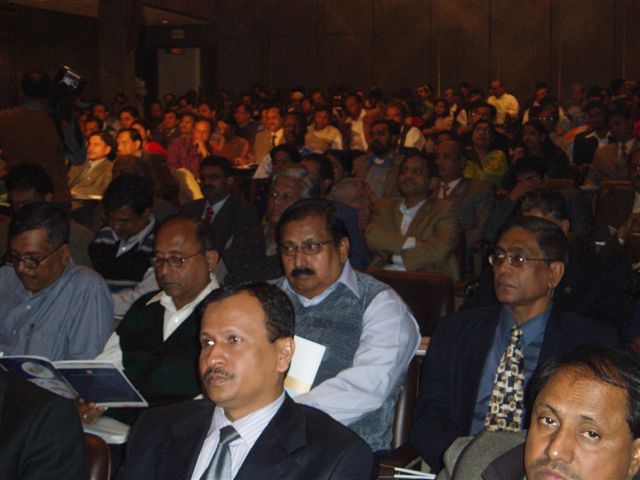 an audience of men listening to a lecture