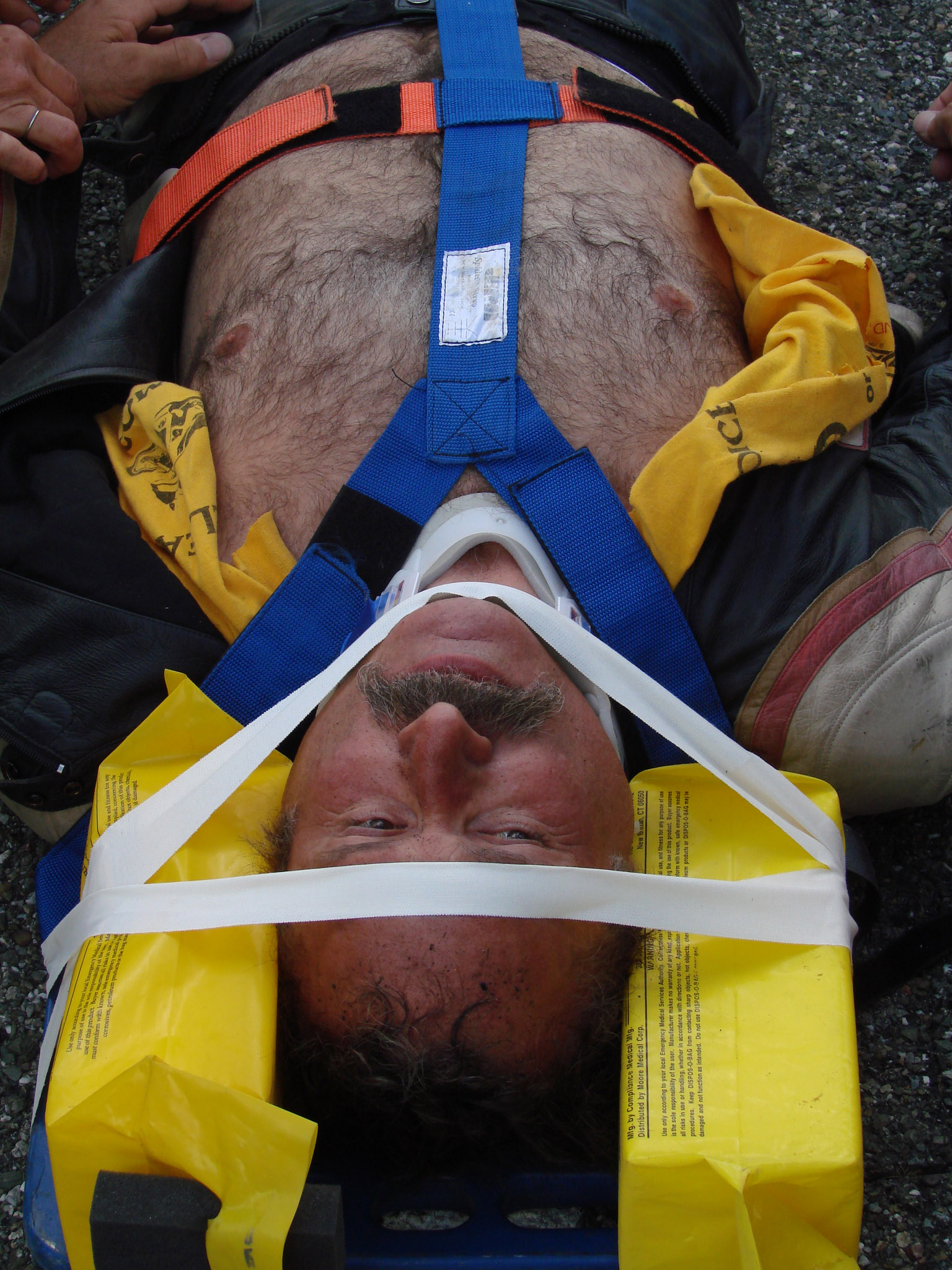a man with a harness on wearing headgear