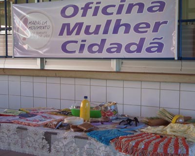 a display table with items for sale next to a sign