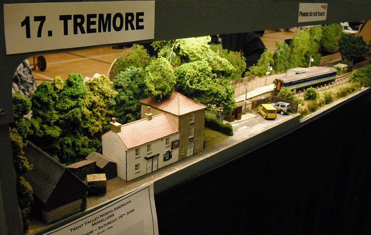 an exhibit featuring a model train and the train yard