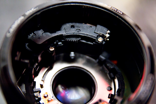 the inside of a camera lens looking down at the lens