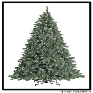 a green christmas tree on a stand against a white background