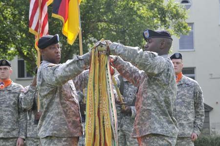 soldiers are dressed in fatigues for a ceremony