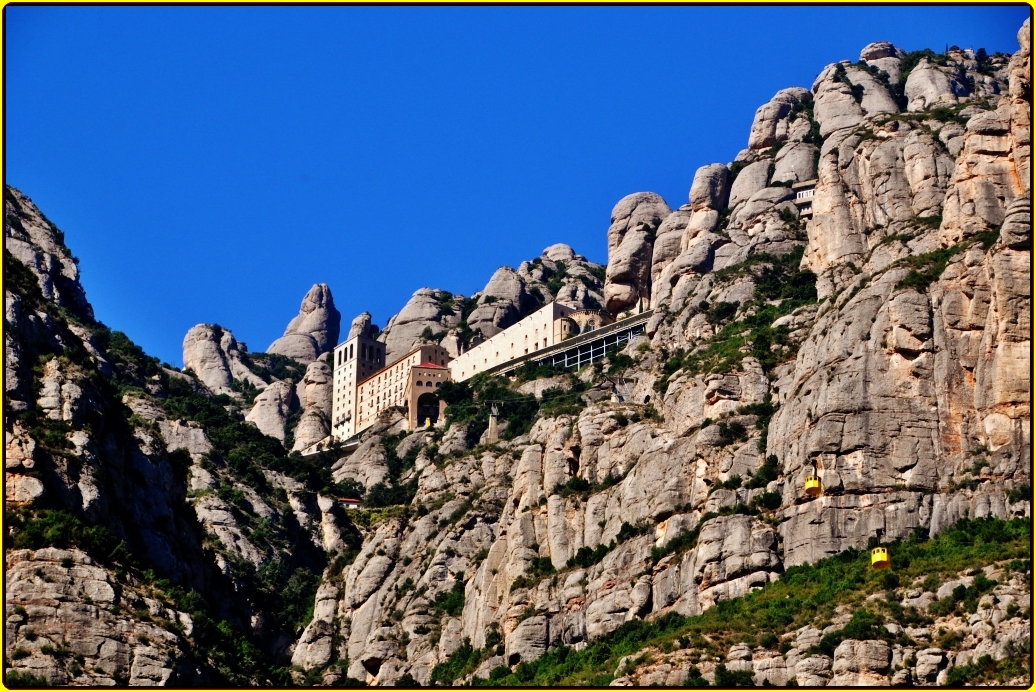 a castle built on top of a mountain cliff