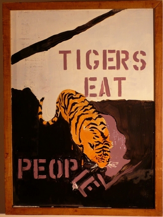 a painting with tigers eat written on the side