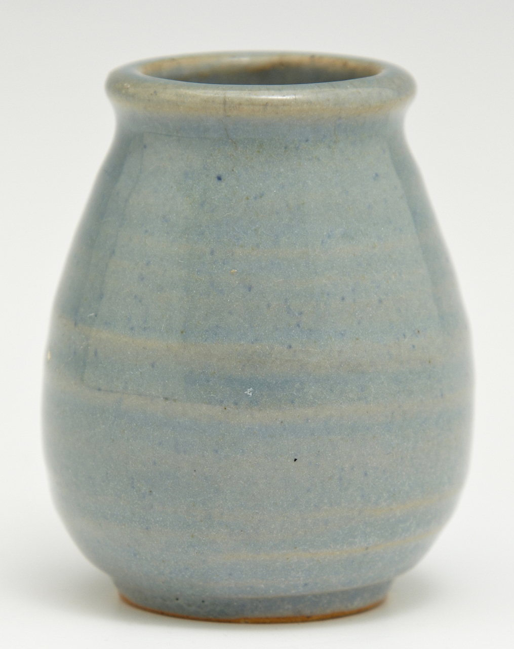 blue vase with a thin, striped pattern on the side