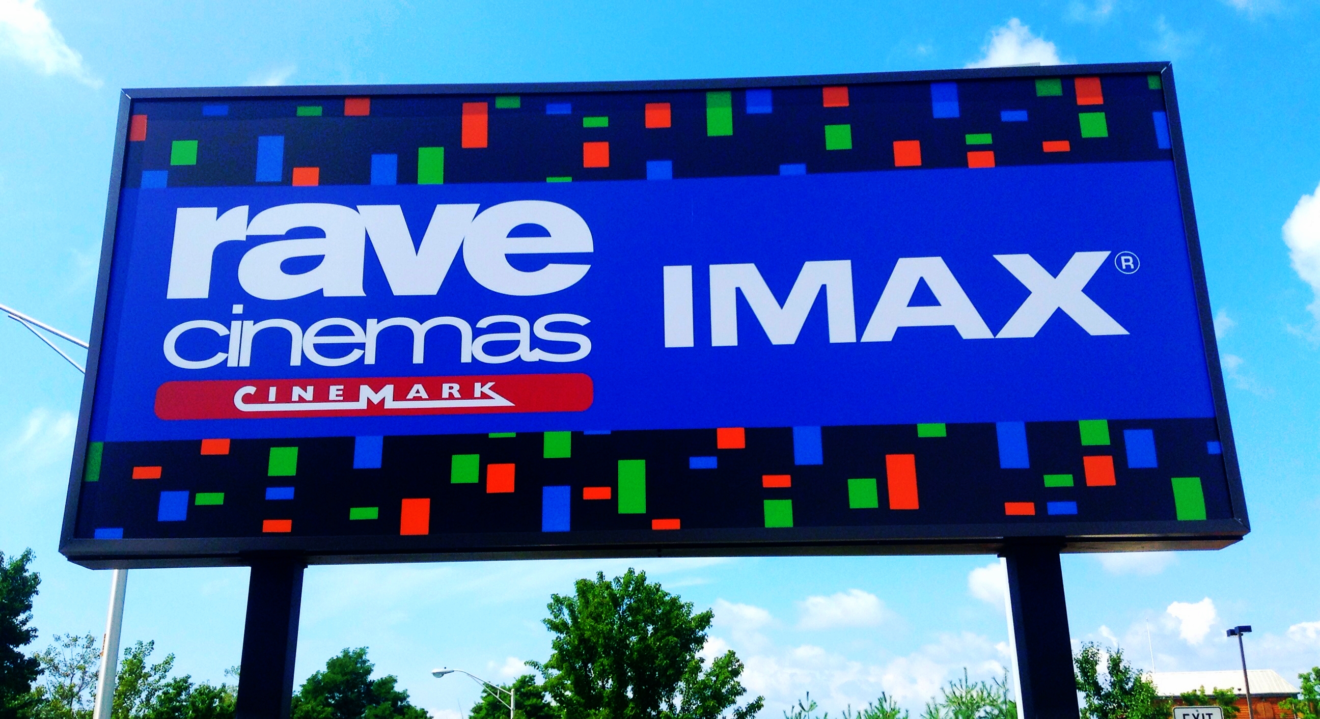 a blue sign advertising rave cinema max