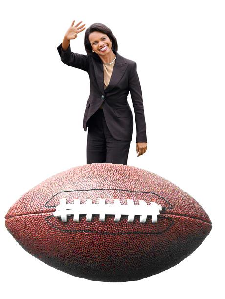 a woman in a suit is standing on top of a football