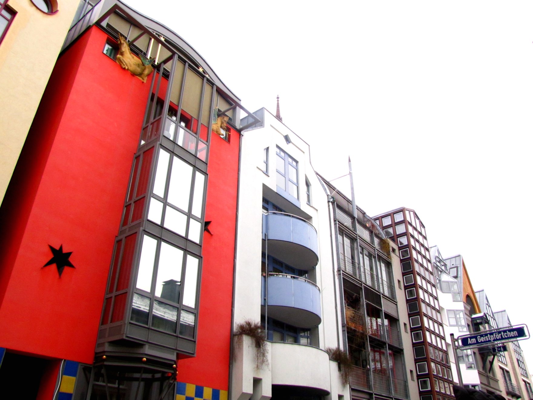 a multi story building next to other buildings